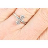 Diamond cluster ring, having two brilliant cut diamonds dispersed at the centre with a line of