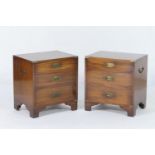 Pair of mahogany campaign style small chest of drawers, each having brass reinforced corners and