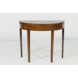 George III mahogany demi-lune tea table, circa 1795, the top crossbanded and with boxwood stringing,