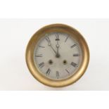 Shipping interest: HMS Kestrel brass bulkhead clock, 14cm silvered dial with Roman numerals, brass