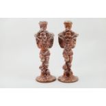Matched pair of Cantagalli figural candlesticks, in the Hispano Moresque style, modelled as winged