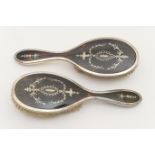 Two George V silver and tortoiseshell pique hairbrushes, by Walker & Hall, Birmingham 1921, with