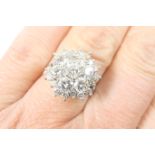 Diamond cluster ring, having a central arrangement of seven round brilliant cut diamonds, each