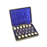 Set of twelve George V silver teaspoons, by The Barker Bros., Chester 1913, cased, weight approx.