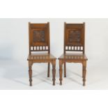 Pair of Victorian walnut hall chairs, circa 1885, with channel moulded outline back enclosing a