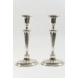 Pair of silver candlesticks in the Adam style, Birmingham 1966, having removable oval nozzles over a