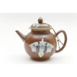 Chinese Batavian teapot and cover, late 18th Century, decorated with figural reserves against a