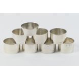 Eight Maltese silver napkin rings, all of plain polished ring form, four being of sterling silver