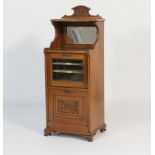 Late Victorian mahogany music cabinet, circa 1890, having an upper shaped shelf over a bevelled