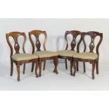 Set of four Victorian mahogany dining chairs, circa 1870, in French taste with shaped cresting rail,