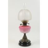 Late Victorian pedestal oil lamp, the mushroom shaped shade frosted and etched with baskets of