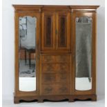 Late Victorian mahogany and inlaid inverted breakfront wardrobe, having a dentil inlaid cornice