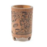 Chinese carved bamboo brush pot, having panels carved with pavilions and peony rock, height 16cm