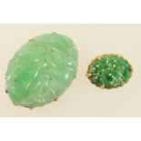 Birks and Ellis carved jadeite small brooch, mounted in 14ct yellow gold, 22mm x 16mm; also a larger