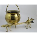 Brass cauldron coal scuttle, circular form with swing handle, three spur feet, 35cm diameter; also a