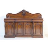 Victorian mahogany breakfront sideboard, circa 1845-60, the back panel with a carved fruiting