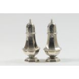 Pair of late Victorian silver pepper pots, London 1900, octagonal baluster form, height 11.5cm,