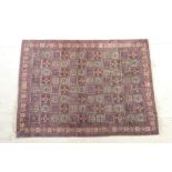Bakhtiari silk rug, having a multi-coloured trellis field with floral details, within a fawn