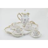 French porcelain cabaret set, circa 1900, comprising shaped tray with moulded gilt edge and