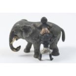 Austrian cold painted bronze, circa 1900, depicting two boys climbing on the back of an elephant,