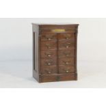 Shannon walnut filing cabinet, circa 1900, fitted with ten fielded panel drawers with original label