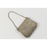 White metal filigree evening purse, 20th Century, worked with flowers and foliage against a