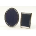 Modern silver oval photograph frame, beaded border and blue velvet backing, interior size 18cm x