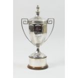 The 'Glyn Dutton' silver trophy, by Walker & Hall, Sheffield 1926, having a cover with finial over a