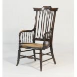 Anglo-Indian ebony armchair, circa 1900, having a shaped cresting rail over a twisted stick back and