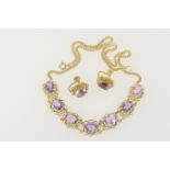 Suite of amethyst jewellery comprising a necklace set with seven oval cut amethysts, each approx.
