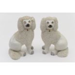 Pair of Victorian Staffordshire poodle chimney ornaments, circa 1870, with white grog fur and