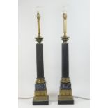 Pair of decorative metal and brass column table lamps, black painted fluted column on a faux