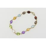 Multi gem set bracelet in 9ct gold, set with thirteen oval cut coloured stones, each approx. 8mm x