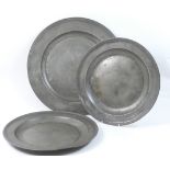 18th Century pewter charger, 52cm diameter; also a pair of 18th Century pewter plates, stamped