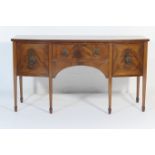 Edwardian mahogany bow front sideboard, in Georgian style, fitted with a central drawer with brass