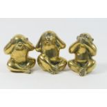 Three polished brass monkey ornaments, 'Hear no evil, speak no evil, see no evil', height 12.5cm