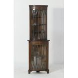 Edwardian mahogany freestanding corner display cabinet, bowfronted and with a single astragal glazed