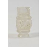 Carved rock crystal bottle, in the Fatimid style, having a central band of kufic script, height 6.