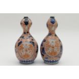 Pair of Japanese Imari gourd vases, late 19th Century, decorated in typical palette with peony and
