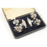 Silver matched six piece condiment, Sheffield 1919/20 and 1933, of faceted octagonal section,