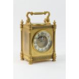 French brass carriage style mantel timepiece, circa 1900, the top with folding handle and an inset