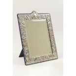 Modern sterling silver dressing table mirror, the rectangular bevelled glass plate bordered with a