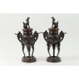 Pair of Japanese bronze incense burners, Meiji (1868-1912), pierced covers surmounted with a