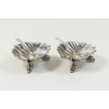 Pair of Victorian silver salts, maker S.C, Birmingham 1860, scallop shell form raised on three