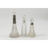 Three silver mounted cut glass scent bottles, comprising an Edwardian trumpet shaped bottle with