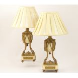 Pair of French gilt ormolu and white marble cassoulettes (converted to table lamps), having an urn