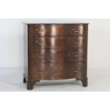 Chippendale Revival mahogany serpentine chest of drawers, the top with moulded edge, over four