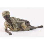 Austrian cold painted bronze figure of a reclining nomad, circa 1900, marked 'Geschutz' and numbered