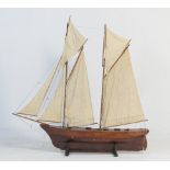 Large gaff rigged pond yacht, circa 1910-30, height 173cm, length 174cm, presented on a later wooden