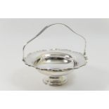 George V silver table basket, by the Barker Bros., Chester 1918, shaped circular form with a